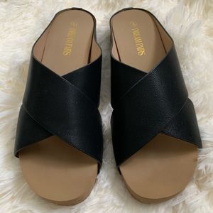 Brand new. Never used. Size 8 sandals. Black and brown. Cork and rubber bottom.